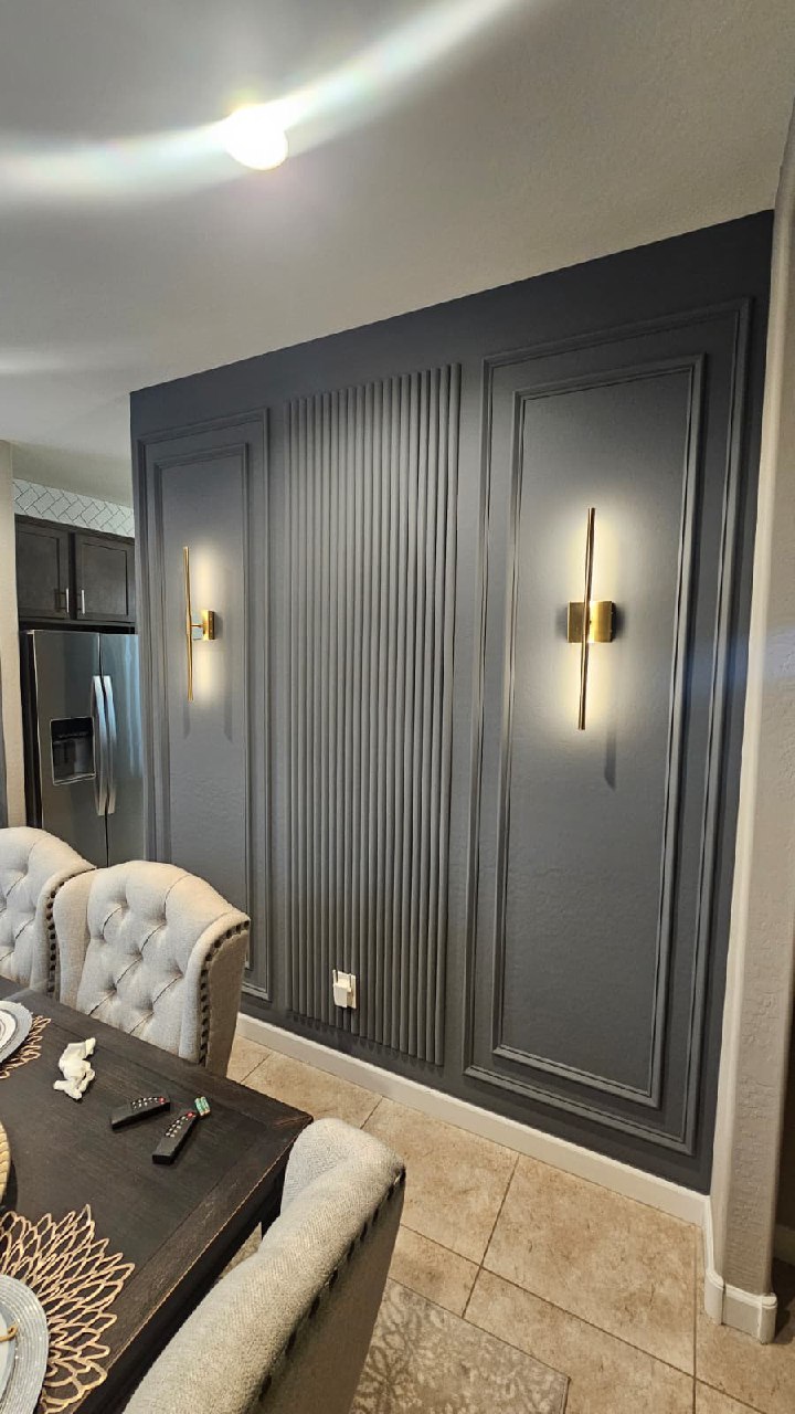 Black chevron TV wall with windmill ceiling fan dark floating shelves Arizona