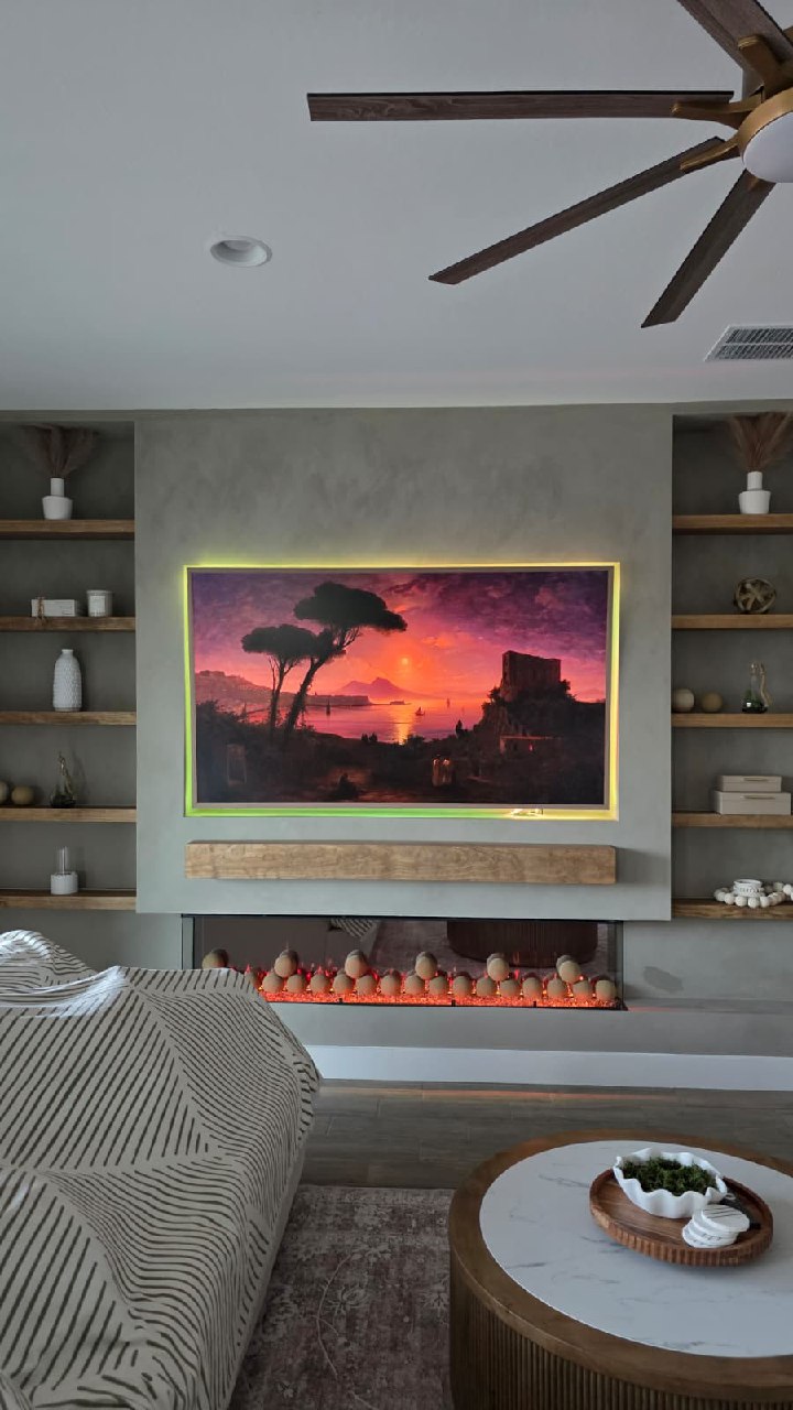 Custom feature wall with recessed TV, floating shelves and three-sided electric fireplace Arizona