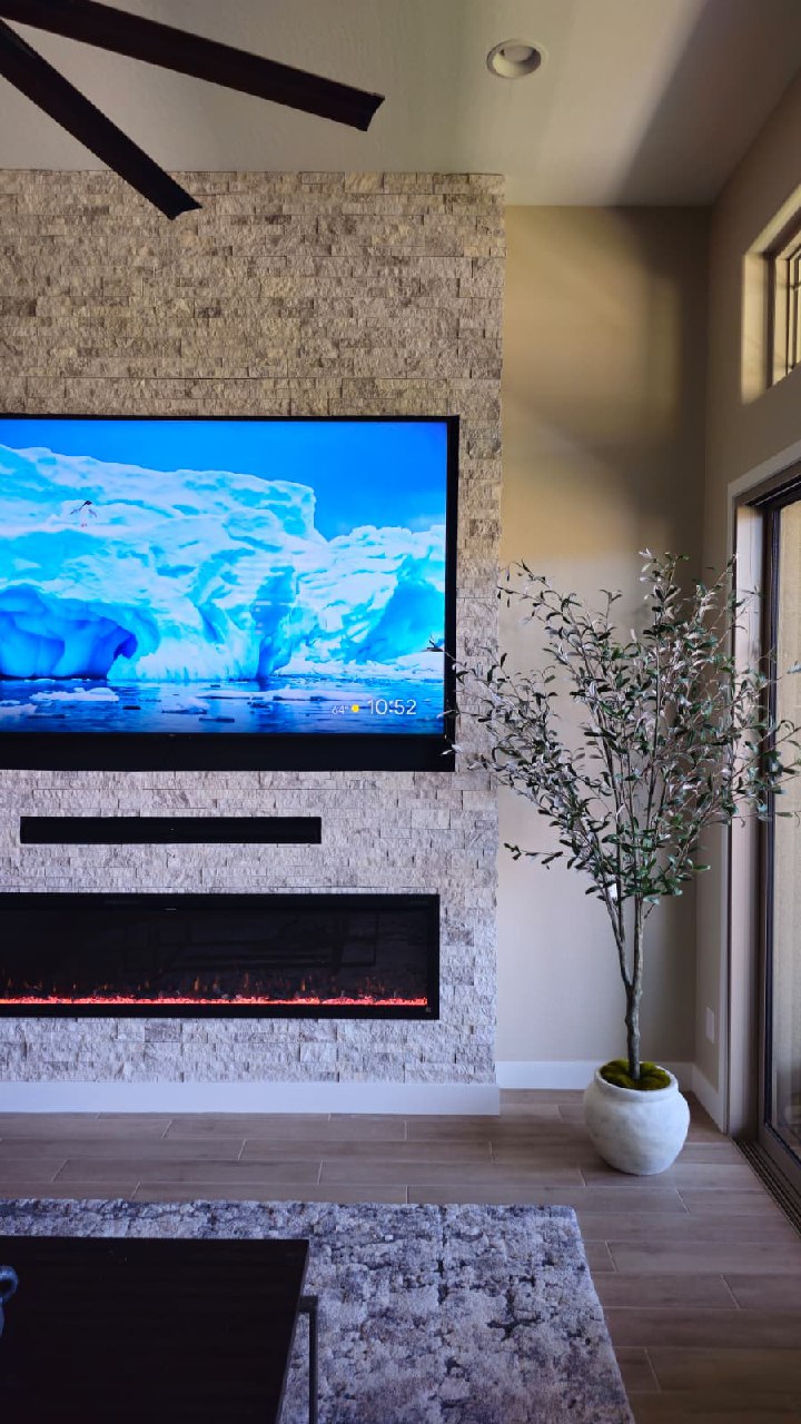 Dark grey shiplap TV wall with floating shelves white cabinets and LED fireplace Arizona