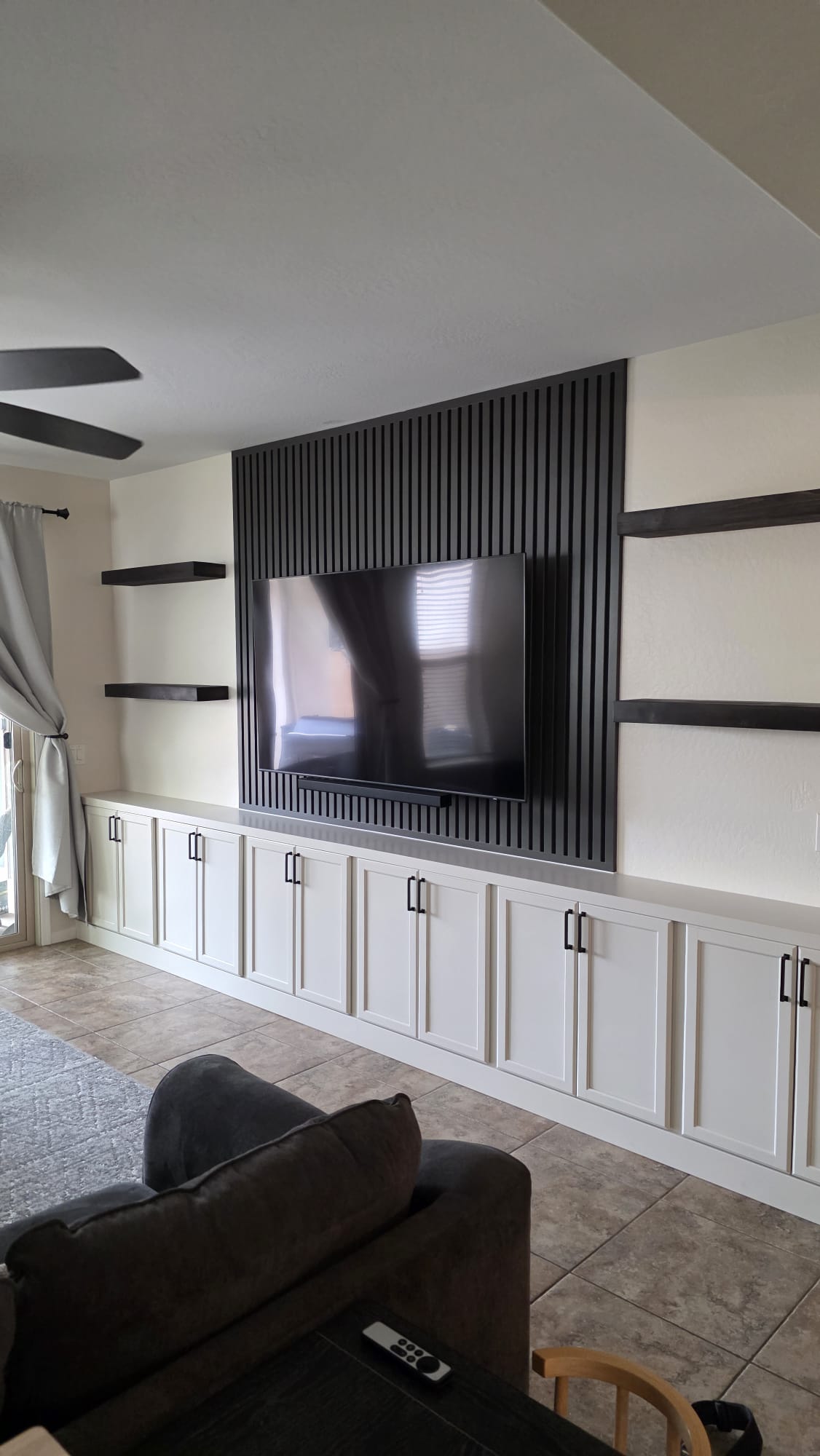 Dark navy full entertainment wall with floor-to-ceiling cabinets and LED fireplace Arizona