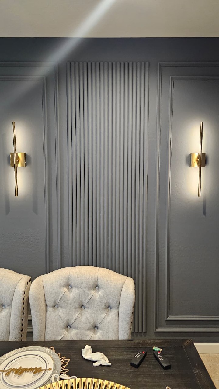 Dark slat TV wall full room view with mid-century chairs and live edge coffee table Arizona