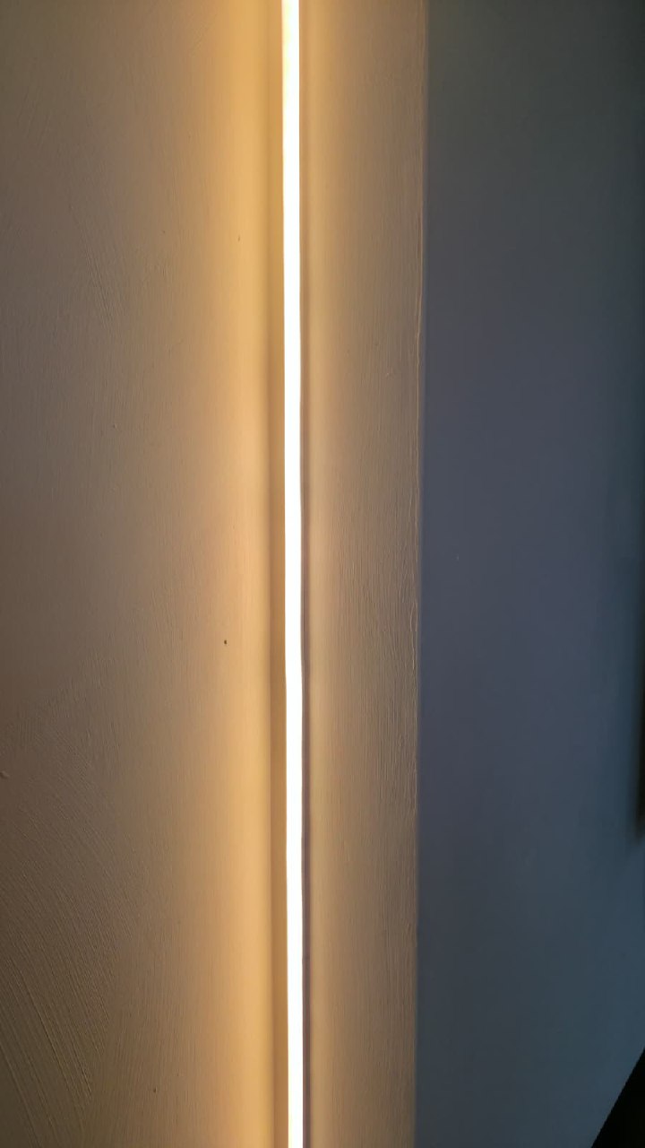 Black mudroom with geometric panel wall, bench and open cubbies Arizona