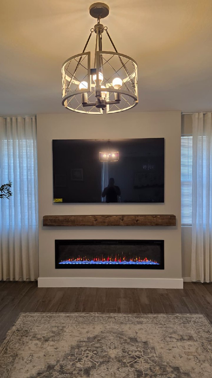 Natural wood vertical slat accent wall with sconce lighting and botanical wallpaper Arizona