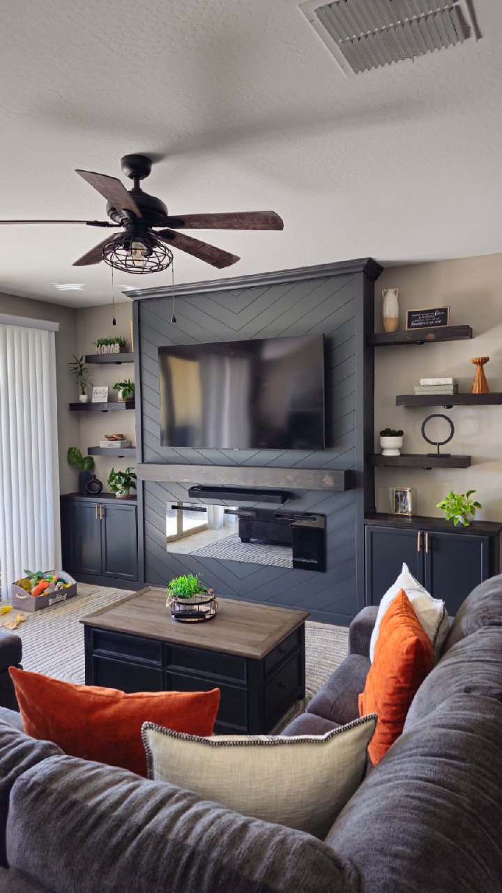 Steel grey chevron entertainment wall wide room view with fireplace and cabinets Arizona