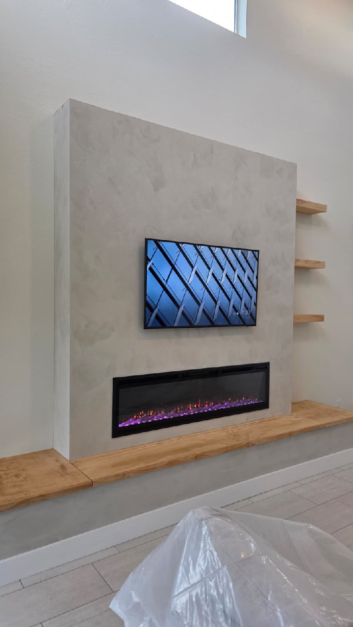 Textured plaster feature wall with TV and linear electric fireplace Arizona