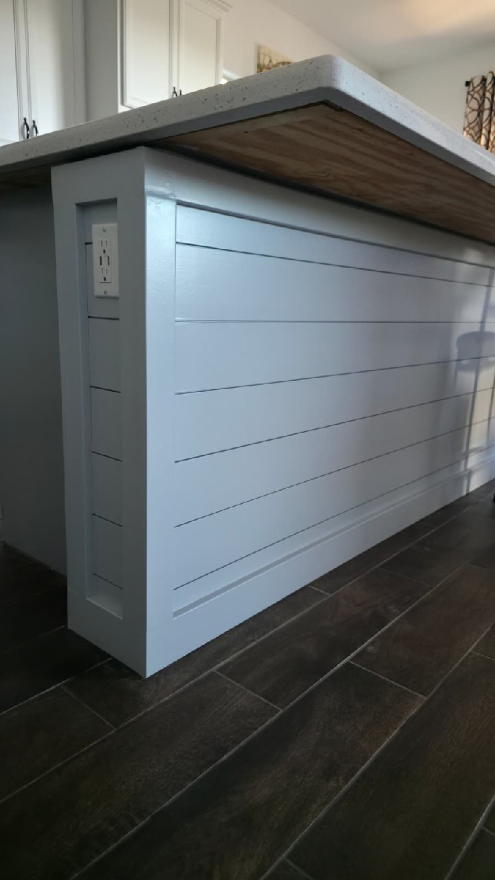 White chevron TV wall full room view with fireplace and sectional sofa Arizona