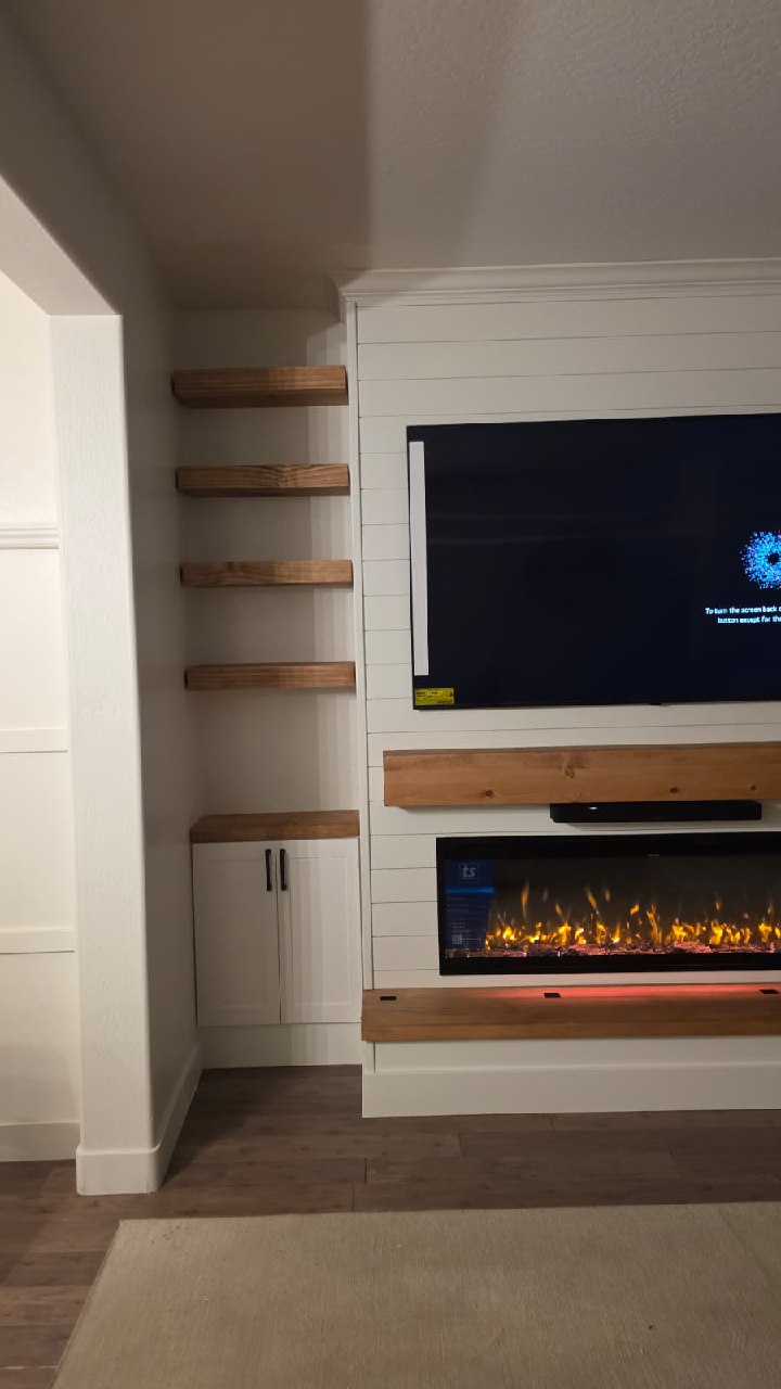 Entertainment wall side view with stacked floating wood shelves and cabinet Arizona