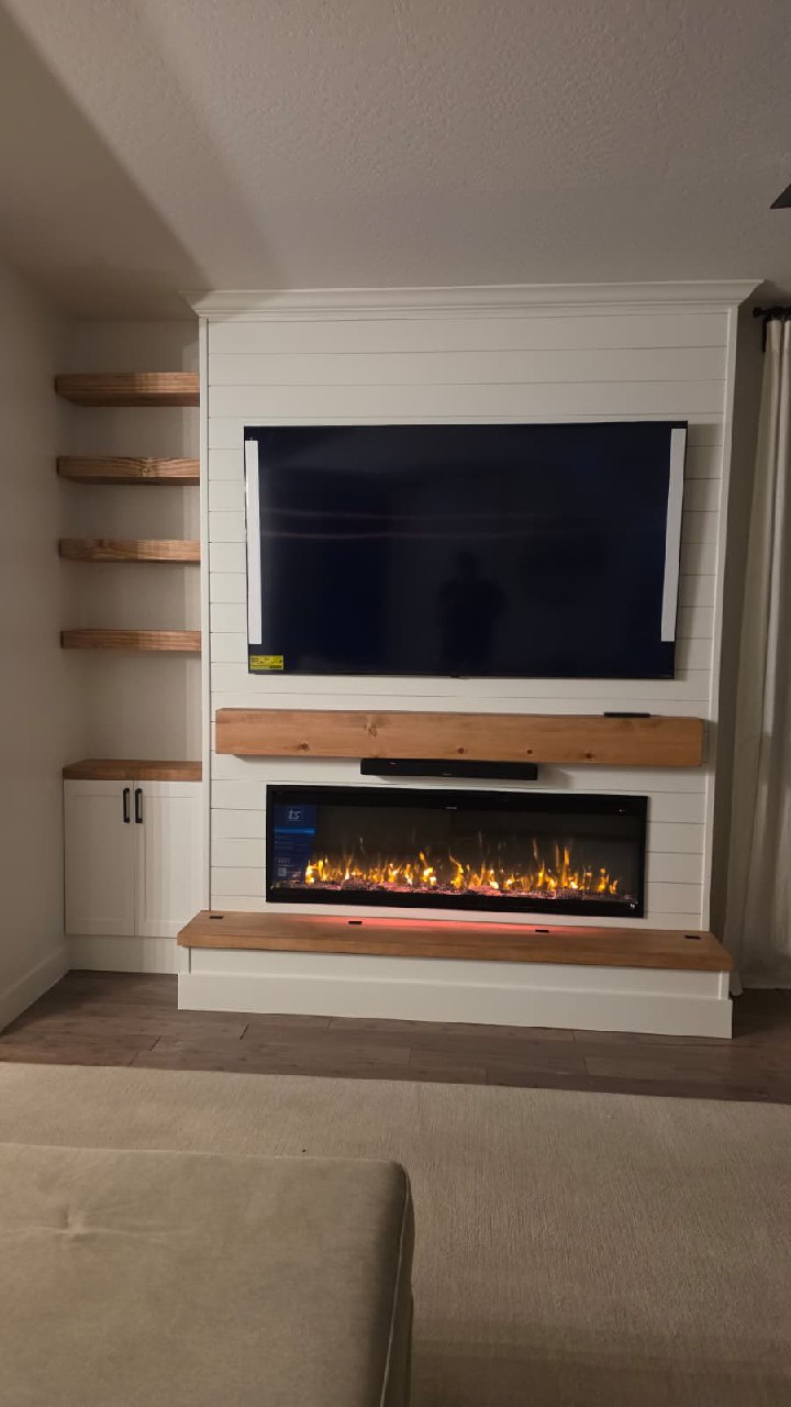 White shiplap entertainment wall with TV and floating wood shelves Arizona