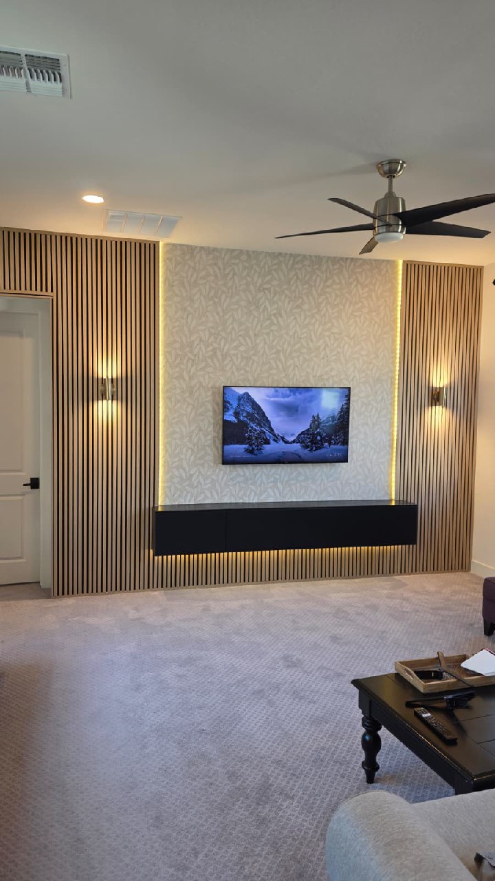 Full view modern wood slat accent wall with wallpaper and TV installation Arizona